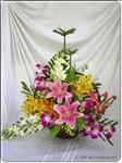 A combination of mix orchids and pink lilies with greens in a handle basket are both fragrant and long lasting. It’s a real delight for whomever receives it.