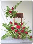 This beautiful bouquet includes 12 red roses and greenery that artfully arranged. This is a perfect gift for a Birthday or any occasion.


