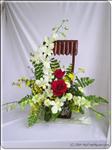 This striking bouquet includes 2 red roses, white orchids, daisies and ferns that artfully arranged. This bouquet appropriate for any occasion.  Approximately 40cm H. 